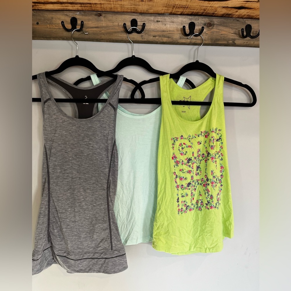 Three ladies tanks. All fit small